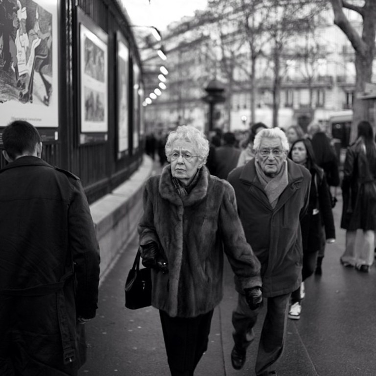 Art lines the gates and fence around the park
