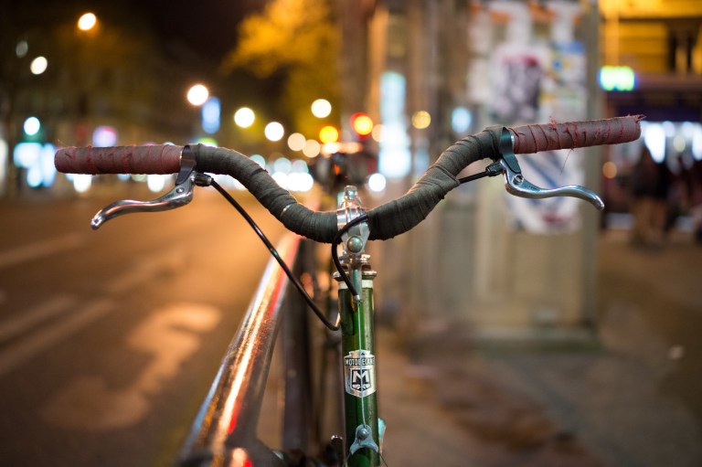 I've been a fan of photography in its various forms for many, many years. But, more recently cycling has stepped into my life and pushed aside some of my time behind the camera. On weekends that I would have normally spent downtown roaming the streets shooting, I now spend in the mountains cycling.  There's been a little bit of friction between the two hobbies over the last couple of years with cycling coming out on top in a pretty big way. It has been interesting to look back through my photo galleries over the last couple years.  The number photos taken while on the bike are taking up a much larger chunk of hard drive space.  Over the last couple of months though, the leisure time has shifted back in favor of photography and I'm sure that some time down the road, cycling will start to take over again.  It's not good or bad, it is what it is.  One thing that has worked quite well is to start bringing a better camera on my rides, instead of my iPhone.  I'm not one for carrying extra weight, and I really don't have much room anyway, but I did try and find a reasonably sized camera that would be up to the job.  I landed on the NEX7 as my riding camera.  I guess you could say it has a good price:weight:performance ratio. All of this brings me back around to the new header. I am much more aware of bikes. Bikes on the road, bikes in shops, bikes in media and bikes locked up on the side of beautiful Parisian streets on perfect spring evenings. This particular bike was locked up outside waiting for a rider. It was dark, the streetlights and the vehicles coming down the road made an excellent backdrop.  I opened up the aperture, cranked up the ISO and came home with this shot. It could be my trifecta: photographing bikes in Paris, three very fine things.