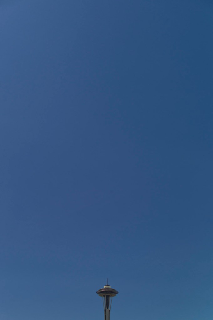 Seattle's Space Needle peeking up from the bottom of the frame.