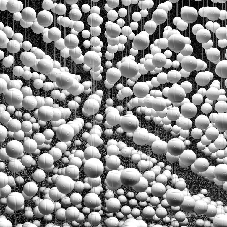 Styrofoam Balls - Taipei, Taiwan (I went to the zoo and came back with a photo of styrofoam balls hanging from the ceiling. It's not really what I expected to come home with as my favorite photo, but it did prove that you can't predict what you will end up with after a day's outing. In fact, the other photo I decided was a keeper was of people, not animals, but people leaning over the rail to get just a little closer to some monkeys. )