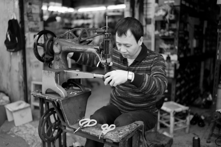 A leather repairman modifying a newly acquired Luigi Case for the M9.