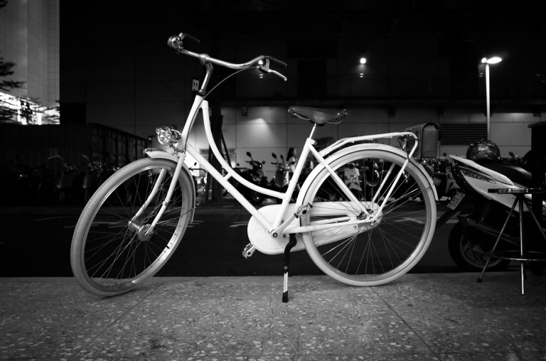 A good looking city cruiser parked in front of a great new little (four seat) restaurant.