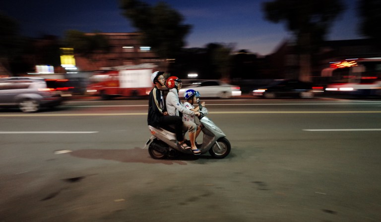 A 50cc scooter is plenty of for a family of three.
