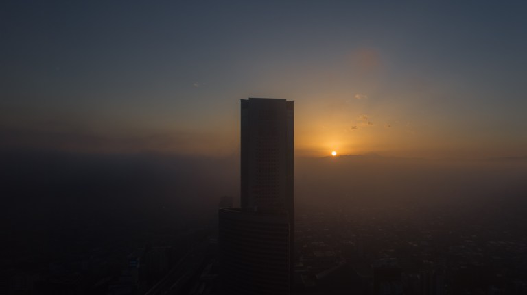Tokyo Opera Tower and a cloudy sunset.