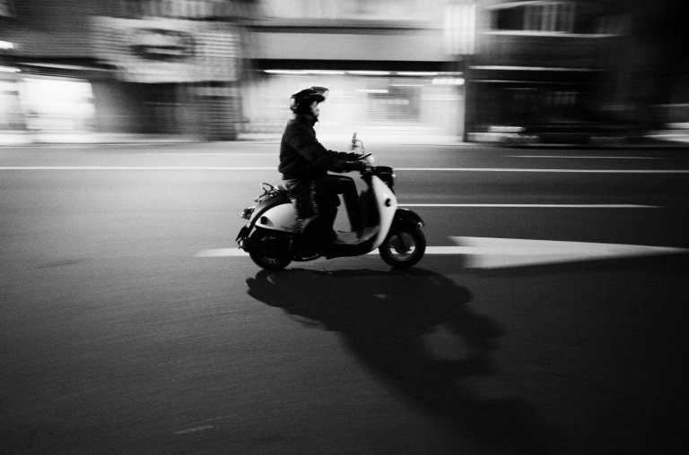 Scootin' down the road. (Ricoh GR w/ 21mm wide-angle adapter)