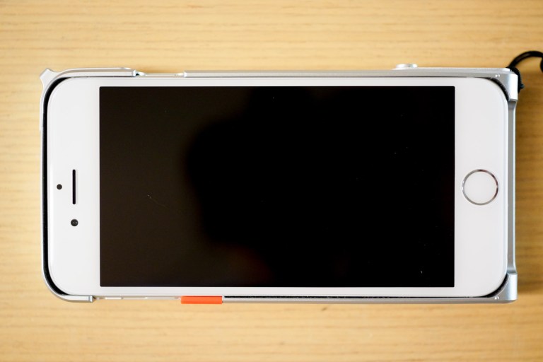 3 of the 4 corners have a little extra material to protect the corners against drops.