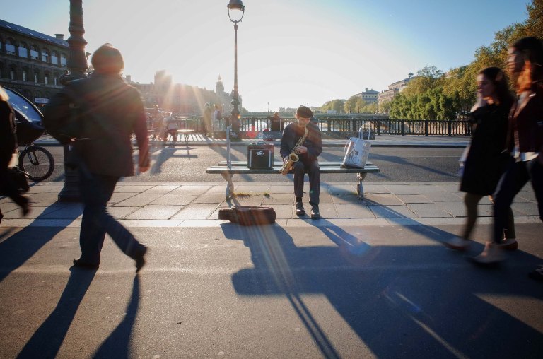 Saxophone man. Nice guy, talented and plays a beautiful 1954 modified saxophone. (Pont d'Arcole, Paris)