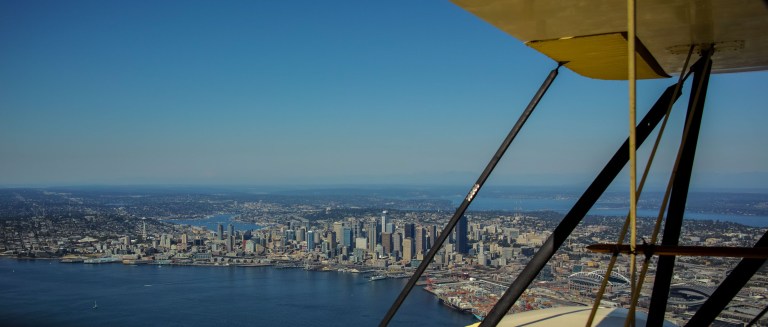 Peeking through the struts of a the 1937 Waco over downtown Seattle. (Sigma DP1 Quattro)