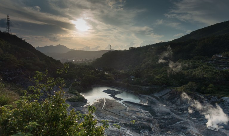 Shooting into the sun over a valley filled with hot spring activity near Beitou.